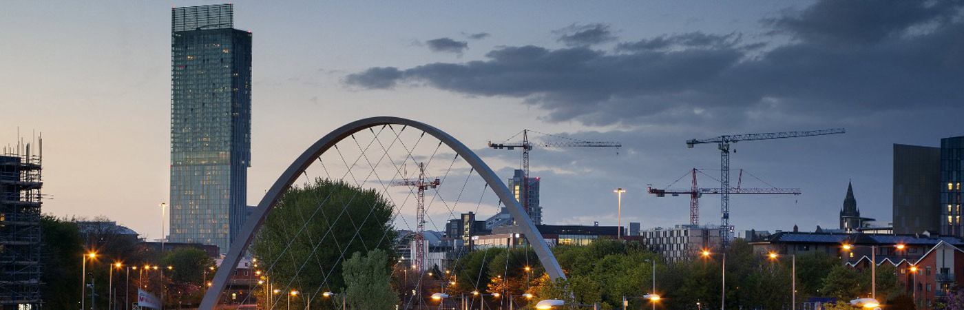 Manchester skyline with cranes.